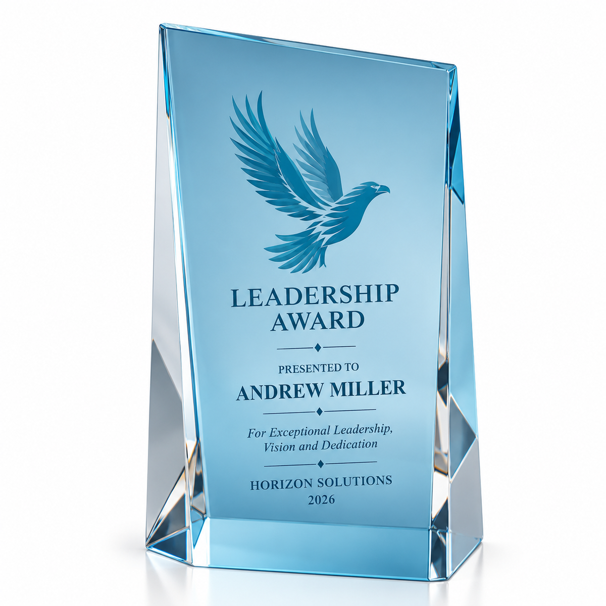 Usury Rise blue glass guest of honor award with etched bird emblem on an angled slab