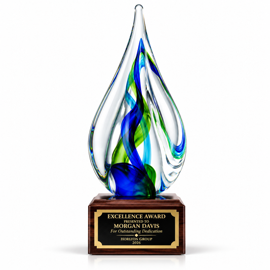Verdant Flame art glass teardrop award with blue and green swirls on dark wood base