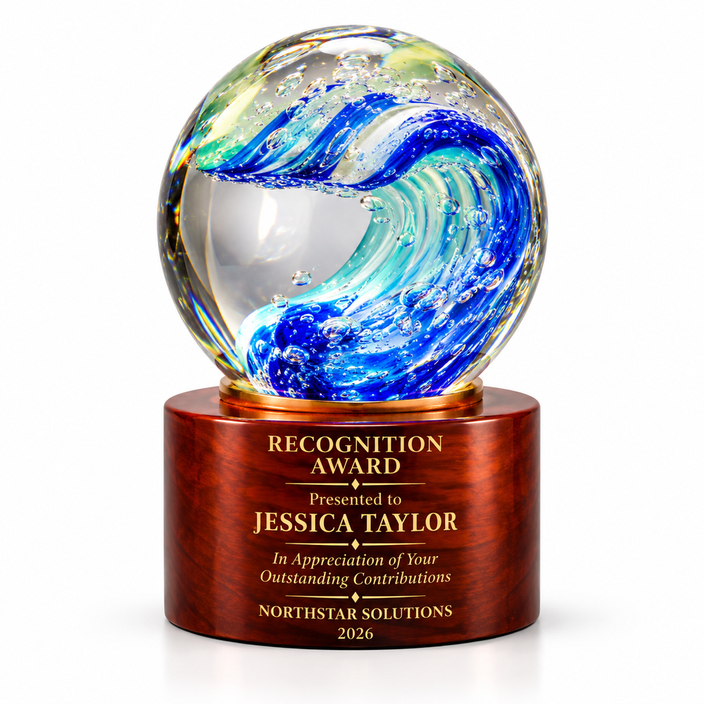 Marine Glow art glass sphere with blue ocean wave swirl on a wooden base